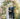 bride and groom under the floral arbor