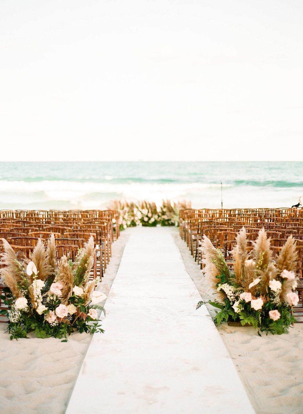 pampas grass wedding ceremony with bamboo chairs