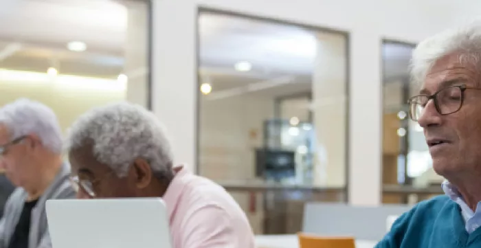 older people working on laptop